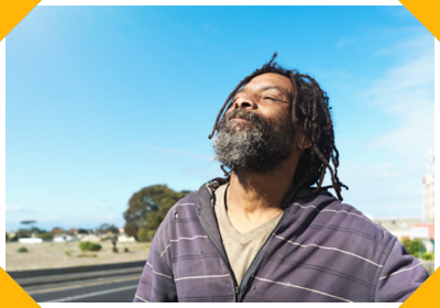 A homeless Black man holds his head high