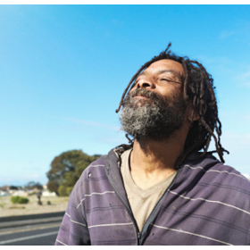 A homeless Black man holds his head high