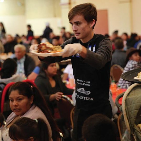 volunteer serving food